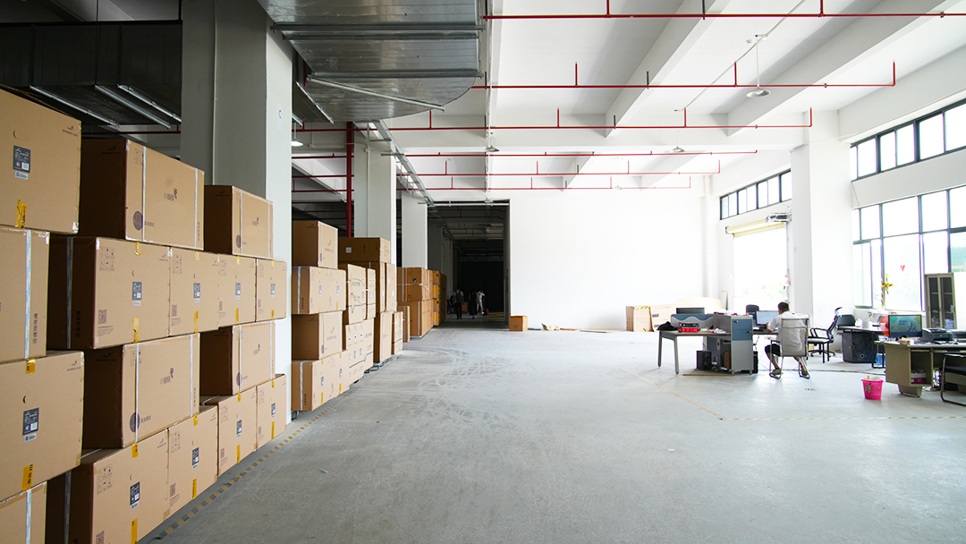 Logistics worker scanning appliance shipments